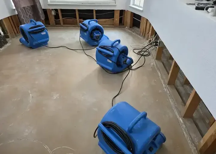 Drying equipment set up in a home during a water damage dry-out